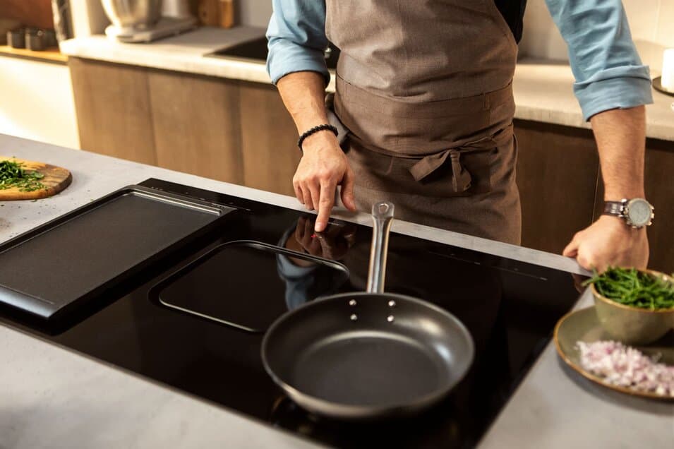 man cooking pan